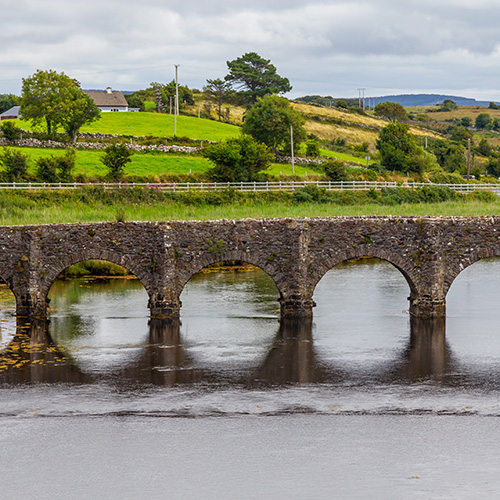 A picture of a bridge on a river